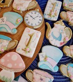 decorated cookies and pastries are arranged on a table