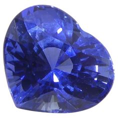 a heart shaped blue sapphire stone on a white background