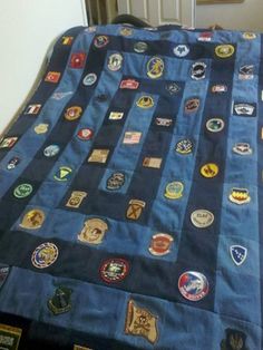 there is a bed with many different patches on it