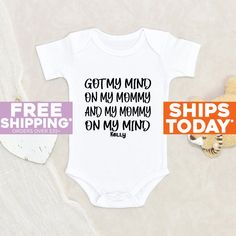 "Funny Baby Clothes Got My Mind On My Mommy Personalized Name Baby Onesie® Baby Shower Gift Cute Unisex Baby Clothes Custom Baby Onesie® Our amazing and cutest personalized Got My Mind On My Mommy Personalized Name Baby Onesie® is 100% cotton, designed, printed and pressed. Perfect for your cute little ones that you can buy on Etsy! Onesies® are printed on Gerber organic. These tend to run small so we recommend sizing up. All of our leahdecorations clothing are 100% organic ultra-soft fabrics and printed with a professional printer using only kid safe ink! Rest Assured that your little one's clothing has the highest premium quality and your graphic will never fade or irritate your little one's soft skin. HOW TO ORDER Choose onesie® size. Note: all of our onesies® are short sleeves. Select Gerber Organic, Custom Baby Onesies, Funny Baby Clothes, Unisex Baby Clothes, One Clothing, Gender Neutral Baby Clothes, Your Cute, Gift Cute, Soft Skin