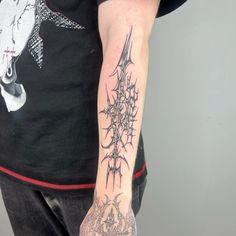 a man with a tattoo on his arm