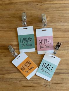 three tags with the words library, nurse, and hall on them