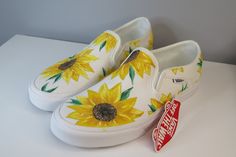 Vans Slip-On Shoes Size 8 Custom Hand Painted Sunflowers New with Box True White These Vans shoes are hand-painted with acrylic paints. The design is sunflowers painted carefully. They are a size 8 in women's and size 6.5 in men's. Never been worn, still have the tags and original box. They've only been painted. The paint is fragile so it shouldn't be washed. These come from a house that owns pets.  I worked on these shoes on and off for a long time, because I wanted them to be the best I could Hand Painted Sunflowers, Painted Sunflowers, Vans Slip On Shoes, Slip On Shoe, White Vans, Sneakers Athletic, Vans Slip On, Custom Hand Painted, Vans Shoes