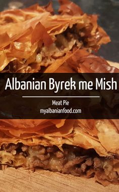 a close up of food on a cutting board with the words, albanian byre me mish