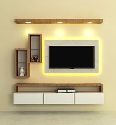 an entertainment center with a flat screen tv mounted on the wall and shelves below it