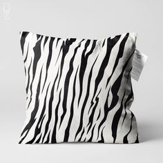 a black and white zebra print pillow sitting on top of a table