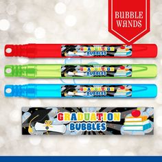 three different colored toothbrushes with graduation decorations on them and the words bubble wands