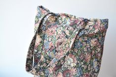 "Floral tote bag. *Pattern may vary slightly from photos due to cut of fabric Dimensions: Height: 15\" (38 cm) Length: 14.5\" (37 cm) Width at the bottom: 3\" (8 cm) The strap length: 24\" (60 cm) Materials: multicolored* upholstery *The colors of the item may vary slightly due to different computer monitor settings. ----------------------------------- If you want other size or fabric contact me via Etsy conversation Made in EU (Lithuania)" Everyday Cotton Shoulder Bag With Floral Print, Rectangular Cotton Shoulder Bag With Floral Print, Rectangular Cotton Floral Print Shoulder Bag, Floral Print Cotton Shoulder Bag, Everyday Floral Print Canvas Bag, Everyday Green Shoulder Bag With Floral Print, Everyday Green Floral Print Shoulder Bag, College Tote, College Tote Bag