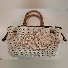 Fabulous, Versatile Purse By Patricia Nash ! Natural Crochet Accented With Brown Leather And Double Bamboo Handles. Comes With A Crossbody Leather Strap, Dust Bag, And Tags. Drawstring Style, Crossbody, And Bamboo Handles. Inside Are 2 Slip Pockets, A Zipper Pocket, Magnetic Closure, Soft Sueded Brown Interior. Satin Antiqued Metal Adornments. One Outside Soft Sueded Slip Pocket For Your Phone. New Condition, Roomy, Measures Approx 15" Across, 9" High, And Approx 5" Width. Boho Style, Vintage Ap Cream Crochet Shopping Bag With Double Handle, Cream Woven Crochet Shoulder Bag, Cream Crochet Bag With Braided Handles For Shopping, Beige Crochet Double Handle Shoulder Bag, Cream Crochet Bag With Braided Double Handles, Elegant Cream Crochet Bag For Daily Use, Elegant White Crochet Bag For Daily Use, Cream Crochet Bag With Leather Handles, Cream Crochet Bag With Adjustable Strap For Shopping