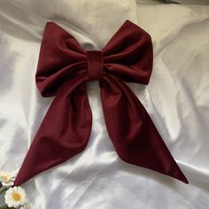 Add a touch of charm and sophistication to your hairstyle with this elegant heavier weight clip on hair bow in a burgundy red velvet. This large adult oversize hair bow is the perfect fashion accessory to effortlessly elevate your look for any occasion. Handcrafted with care, this handmade fabric hair bow clip adds a touch of classic glamour, sophistication and style to your outfit, whether you're heading to a special event, wedding or simply want to add a chic flair to your everyday look. Stand Red Hair Bows Aesthetic, Red Bow Hair Clip, Red Bow Aesthetic, Red Bow In Hair, Bridesmaid Fascinator, Bow Wedding Hair, Red Bow Hair, University Room, Hair Birthday