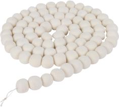 white round beads with tassels and string on a white background for jewelry making