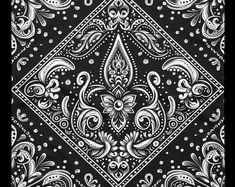 a black and white bandanna with an ornate design