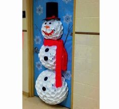 a snowman door decoration made out of toilet paper