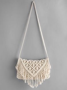 a macrame bag hanging on a wall