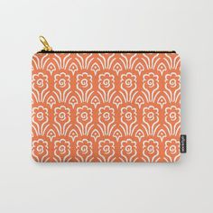 an orange and white pattern carry - all pouch