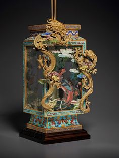 an ornately decorated clock with gold dragon decorations