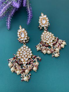 About 5 inch long and 2inch wide . Pachi kundan earring. High high quality Ahmedabadi pachi kundan and Hydrabadi pearl work.  Push back . Traditional Heavy Kundan Pearl Earrings, White Meenakari Kundan Chandelier Earrings, White Kundan Chandelier Earrings With Meenakari, Traditional White Kundan Chandelier Earrings, Traditional White Kundan Danglers, Kundan Danglers With Mirror Work, Pearl Work, Polki Necklace, Kundan Earrings