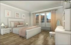 a white bedroom with wood flooring and pictures on the wall