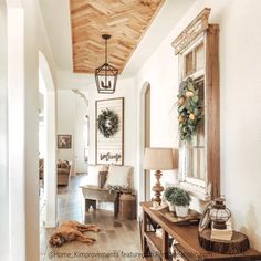 a dog laying on the floor in a hallway