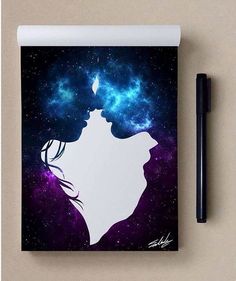 a notebook with a drawing of a woman's face and stars in the background