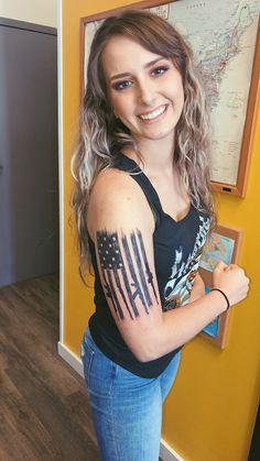 a woman with a tattoo on her arm