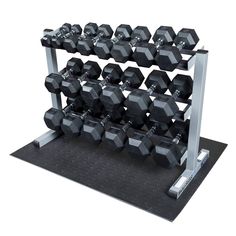 a set of dumbbells are sitting on a stand with two rows of black dumbbells