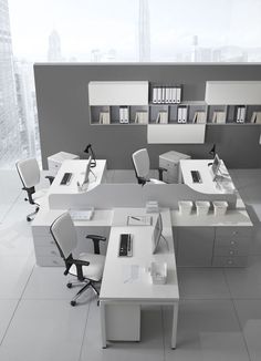 an office with two desks and several chairs