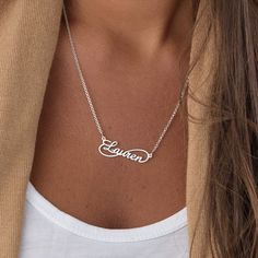 "Own Engraved Nameplate Jewelry Gifts for Her: Customizable dainty nameplate necklace in 18k gold, rose gold, sterling silver 925. The perfect gift for mom, grandma, wife, sister, best friend or yourself. ✨ SIZE & MATERIALS ✨ Material: Sterling Silver 925, 18K Gold Plated Sterling Silver 925, 18K Rose Gold Plated Sterling Silver 925, 18K Gold Vermeil Plated Sterling Silver 925 Thickness: 1.1mm / 0.04\" Height of pendant: 11.18mm x 34.29mm / 0.44\" x 1.35\" Chain style: Cable Chain length: 14\" + Silver Name Necklace With Clavicle Chain For Birthday, Elegant Silver Infinity Name Necklace, Personalized Infinity Jewelry In White Gold, Personalized Infinity White Gold Jewelry, Personalized White Gold Infinity Jewelry, Personalized Minimalist Infinity Necklace, Silver Infinity Name Necklace In Sterling Silver, Custom Name Infinity Jewelry For Mother's Day, Sterling Silver Nameplate Necklace With Clavicle Chain