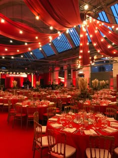 a banquet hall with red and white decor