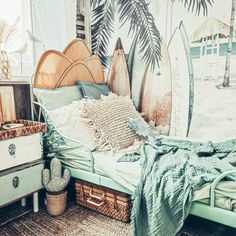 a bedroom with surfboards on the wall and a bed made up in wicker