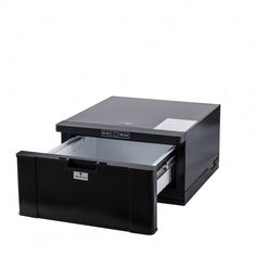 an open file cabinet sitting on top of a white floor next to a black drawer