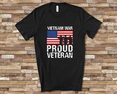 a black shirt with the words wwh proud veteran on it