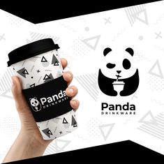 a person holding a cup with panda on it