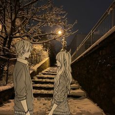 two people standing on snow covered steps in front of a tree at night with street lights