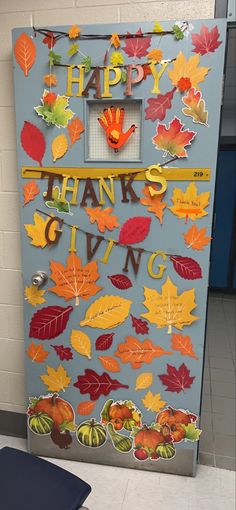 a refrigerator decorated with fall leaves and the words happy thanksgiving giving written on it's door