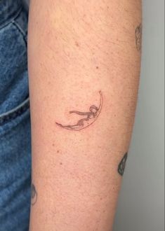 a person with a small tattoo on their arm