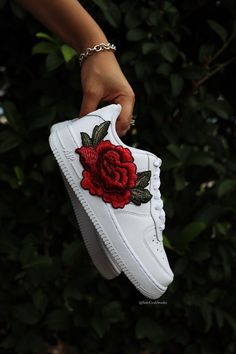 Beautiful Red Rose Flower Embroidered on White Air Force 1 Sneakers. Embroidered red rose flower patch Custom made-to-order sneaker. Brand new 100% authentic Nike AF1 Low with box! Free shipping within the US territory! Need a different color of sneakers? Let us know which color you're looking for and we'll find it for you. Have an idea for your embroidered red rose custom sneakers? Please send us a message here. We'll get back to you within 48hrs! Air Force 1 Sneakers, White Air Force 1, Custom Af1, White Air Forces, Wedding Sneakers, Beautiful Red Roses, Custom Air Force 1, Red Rose Flower, Flower Patch