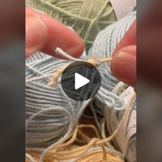 someone is knitting yarn with their fingers and thumbnails in order to see the video