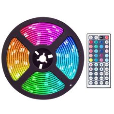 the multicolored led strip light is next to a remote control on a white background