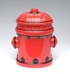 a red fire hydrant is shown against a gray background with the top section missing