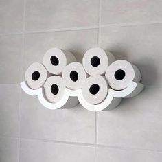 several rolls of toilet paper are stacked on top of each other in the shape of a cloud