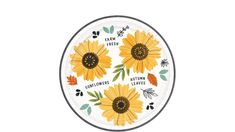 a white plate with yellow sunflowers and leaves painted on the inside of it