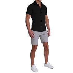 A true athletic fit short sleeve button down crafted from a cotton-spandex blend, this black short sleeve is as soft and stretchy as it gets. "The Roth" is the most versatile button down for in all seasons, featuring shortened length and a curved hemline, leaving you looking and feeling fresh for both casual wear and a great night out. Care: Machine wash cold. Hang to dry. Fabric: 90.5% Cotton / 9.5% Spandex Model is 6' and 185 lbs. filling out size Medium. SIZING Our shirts are designed for a " Button Up With Shorts, White Shoes Men, Stretch Dress Pants, Short Sleeve Dress Shirt, Fitted Dress Shirts, Great Night, Navy Shorts, Suit Shop, Cut Shirts