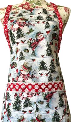 a woman's apron with christmas decorations on it