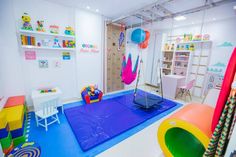 a playroom with various toys and accessories