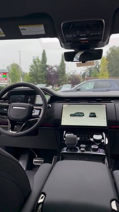 the interior of a car with black leather seats