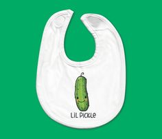 "Baby Bib - Cute Drawn Lil Pickle with Handwritten Title - White cotton bib - Washable - Neck opening when fastened : approx. 10\" diameter - Flat size: 7.5\" wide x 11\" tall - PLEASE NOTE that due to various monitors and printers, colors may vary. - Need a custom order? Please convo me and I can do my best to help :)" Playful White Cotton Bib, Cute Cotton Bib As Gift, Baby L, Gender Neutral Baby, Baby Clothing, Baby Bibs, Pickles, White Cotton, Clothing Items