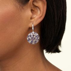 Colleen Lopez Iolite and Zircon Round Cluster Drop Earrings  Elevate your style when you accessorize with these beautiful gemstone earrings. The sterling silver drops feature exotic blue iolite stones clustered with sparkling white zircons for a look that's sure to add instant elegance to any ensemble!       Approx. 1-1/2"L x 7/8"W     Drops approx. 1-1/16"L x 7/8"W     Stamped .925; rhodium plating     Pierced with English lock backs     Earrings have disc-shaped open cluster design with prong-set oval blue iolites and round white zircons      Drops connect to hinged, silver hoops   Stone Information       All sizes and weights approximate     Total Carat Weight: 8.23ct     Blue Iolite - Oval; 6.46ct     White Zircon - Round; 1.77ct Iolite Stone, Cluster Design, Silver Hoops, Gemstone Earrings, Rhodium Plated, Prong Setting, Sparkle, Plating, Drop Earrings