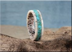 "This is a beautiful, handcrafted Artisan ring made in my small shop in Ottawa, Ontario, in Canada. This beautiful ring holds a stunning Kingman Turquoise stone inlay, and is offered on a deer antler (sustainably cast-off sourced) comfort fit channel core. US full and half ring sizes from 5 - 13 are available, in widths of 6mm or 8mm. If you require a custom order at a different size, please send me a message and I will do my best to accommodate.  NOTES: Shown in 6mm and 8mm comfort fit widths. A luxurious, solid Walnut box with shop logo is available at a bundled discount, or as a separate presentation upgrade here: https://www.etsy.com/ca/listing/1227551836/solid-black-walnut-ring-presentation-box IMPORTANT - RING SIZING: Please be certain to have your ring size checked professionally by Rustic Untreated Ring As A Gift, Rustic Untreated Ring For Gift, Rustic Untreated Rings For Gift, Rustic Ring Jewelry Gift, Unique Handmade Turquoise Promise Ring, Antler Rings Women, Antler Rings, Channel Ring, Deer Antler Ring