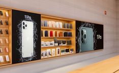 an apple store display with iphones on the wall